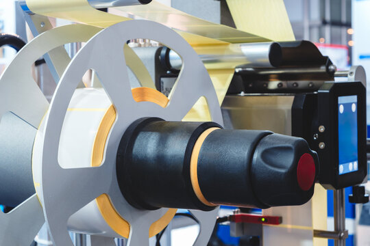 Fragment of conveyor sticking labeling machine. tech industrial technology background