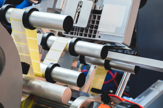 Fragment of conveyor packaging sticking labeling machine. tech industrial technology background