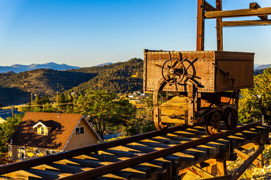Iconic rusty minecart with Virginia City cityscape