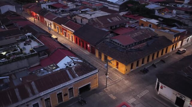 Aerial view of the colonial architecture and cobblestone streets of Antigua Guatemala at dusk in Antigua Guatemala, Sacatepequez Department, Guatemala.