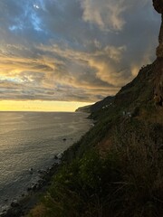 Dramatic sunset over the Atlantic Ocean viewed from the cliffs of Madeira Island, Portugal © olga