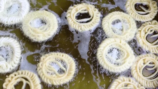 Imarti or jalebi an indian dessert fried in oil then dipped in sugar syrup