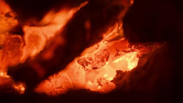 Glowing ember close up vibrant orange heat intense fire detail macro perspective