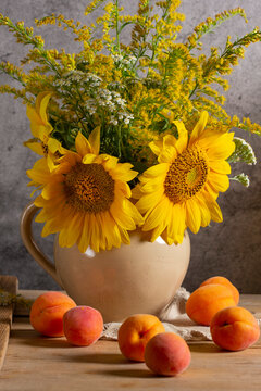 Rustic Sunflower Bouquet with Goldenrod, Yarrow and Apricots on Wooden Table