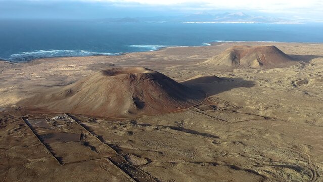 Aerial view over La Mancha craters in the volcanic Area of the Bayuyo, on the Island of Fuerteventura, Spain.