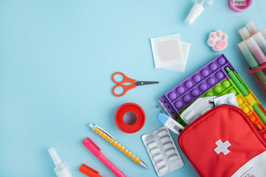 First aid kit contents and stationery flat lay
