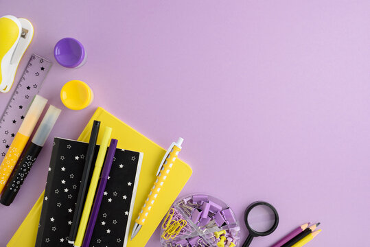 School supplies on purple background