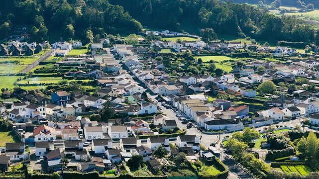 Aerial view of Sete Cidades village with red-roof houses and narrow asphalt roads, Sao Miguel Island, Azores