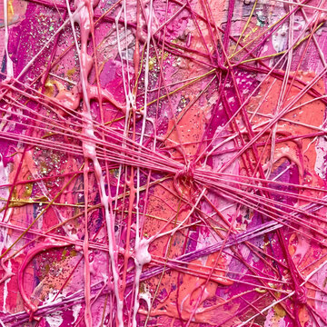 String art patterns constructed from entangled neon threads form a complex web of interconnected lines against a deep pink background that serves as a captivating texture for modern creative concepts.