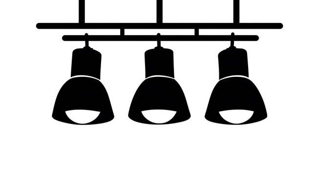 A trio of black track lights hanging from a rail, illuminating a space