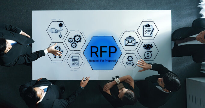 Business Team Overview Engaged in Request for Proposal Process with Visual Icons and Data Analysis on Conference Table. Bitwise.