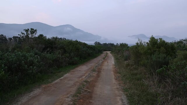 country road, delicate fog having below Klein Mountains, Stanford, South Africa