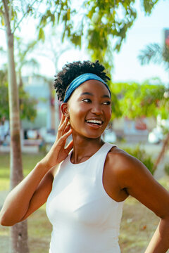 African woman expressing joy and confidence in nature