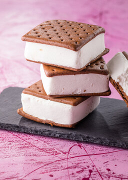 Delicious ice cream sandwiches  on pink table