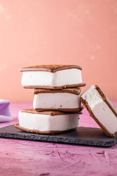 Delicious ice cream sandwiches  on pink table
