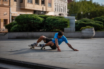 Skater falling down from skateboard in urban city © Zoran Jesic
