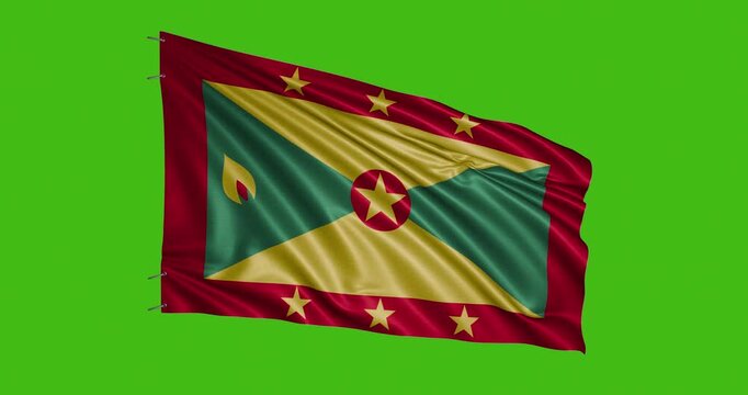 Grenada flag waving on a green background during a sunny day