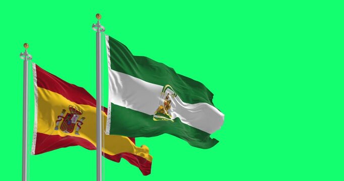 Flags of Andalusia and Spain waving isolated on green background.