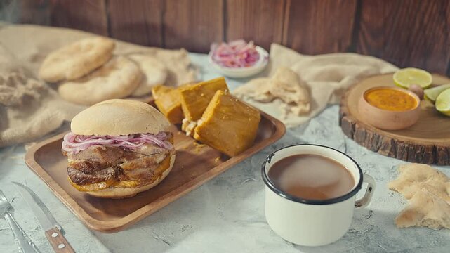 Traditional Peruvian Breakfast with Chicharron Pork Sandwich Tamale and Coffee