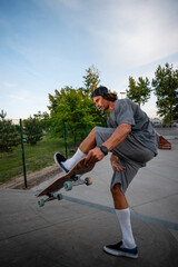 Skateboarder balancing board practicing street tricks in skate park © Zoran Jesic