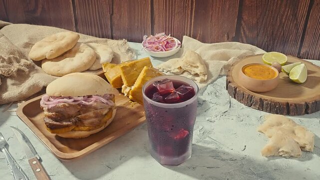 Refreshing Chicha Morada alongside a Peruvian Pan con Chicharr&oacute;n Combo