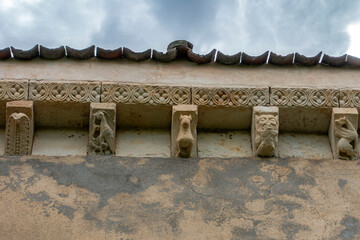 Carved stone corbels depicting birds, beasts and zoomorphic figures beneath a floral cornice at the 12th-century Romanesque Church of Nuestra Senora de la Asuncion in Duraton, Sepulveda, Segovia,Spain © Nandi Estévez