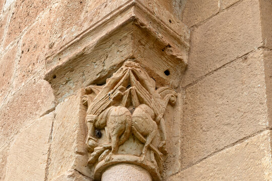 Carved stone capital depicting quadruped figures on an apsidal window column at the 12th-century Romanesque Church of Nuestra Senora de la Asuncion in Duraton, Sepulveda, Segovia, Spain