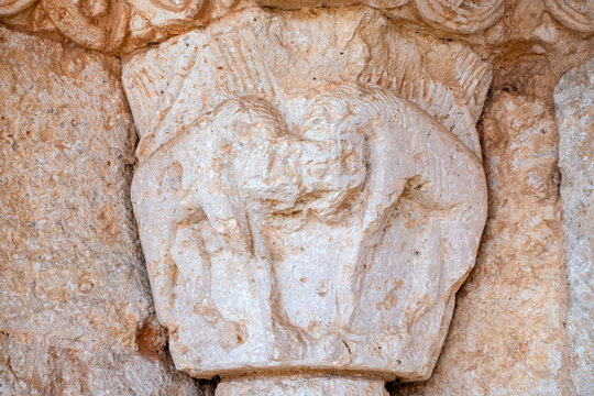 Carved Romanesque stone capital depicting quadruped figures at the portal of the Church of San Martin, a 12th-century Romanesque temple in Rejas de San Esteban, Soria, Castilla y Leon, Espana