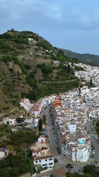 Aerial vertical view of Frigiliana a picturesque white town on the Costa del Sol located in the Sierra de Almijara mountains in southern Spain