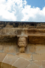 Transition Romanesque-Gothic carved stone corbel depicting a human face under the roof eaves of the Church of Nuestra Senora de la Asuncion in Tuesta, Alava, Basque Country, Espana © Nandi Estévez