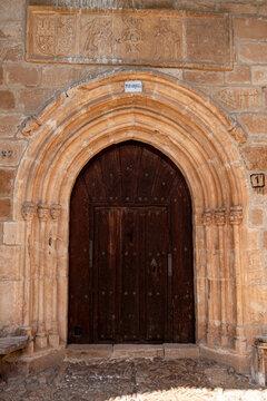 Transition Romanesque and Gothic portal with pointed archivolts and carved relief lintel at the Church of San Andres, Tabliega, Las Merindades, Burgos, Castile and Leon, Spain