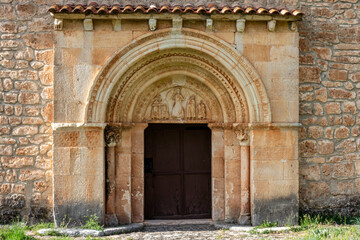 Romanesque portal with carved tympanum, semicircular archivolts, and corbels at the Hermitage of Inmaculada Concepcion, 12th century, Tablada del Rudron, Tubilla del Agua, Burgos, Spain © Nandi Estévez