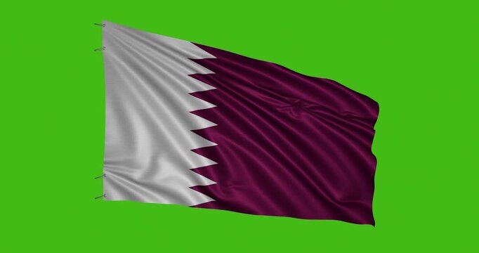 Qatar flag waving against a green background during the day