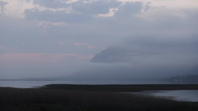 delicate fog hovering below Klein Mountains at dusk, Stanford, South Africa