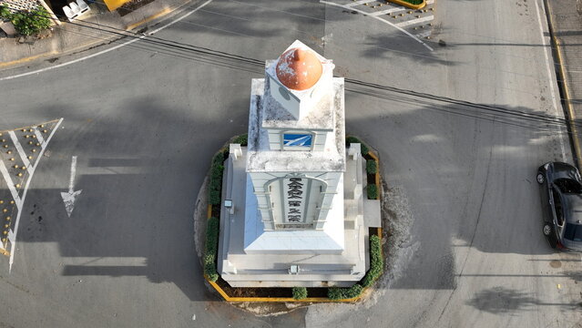 Aerial view of the clock tower in the center of a roundabout in Sabana de la Mar, Hato Mayor Province, Dominican Republic.