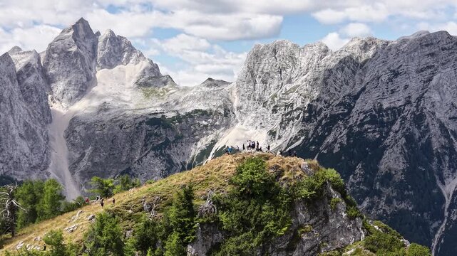 Drone shot of hikers at Slemenova Spica peak in Julian Alps, Slovenia