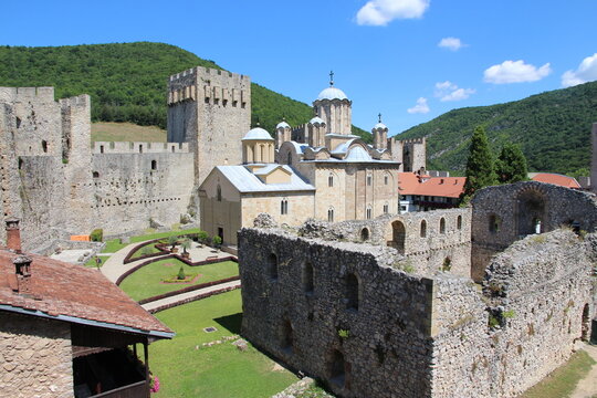 A view of ruined old refectory, Despot's tower, the wall and the Church of Holy Trinity inside the fortified Manasija Monastery in Serbia