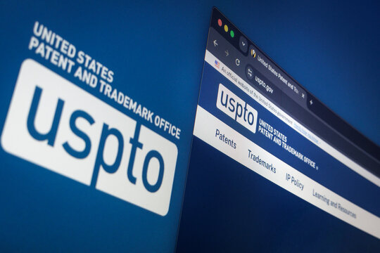 Raleigh, North Carolina - August 4, 2026: Close-up of a computer screen showing the USPTO United States Patent and Trademark Office website and logo in the background.