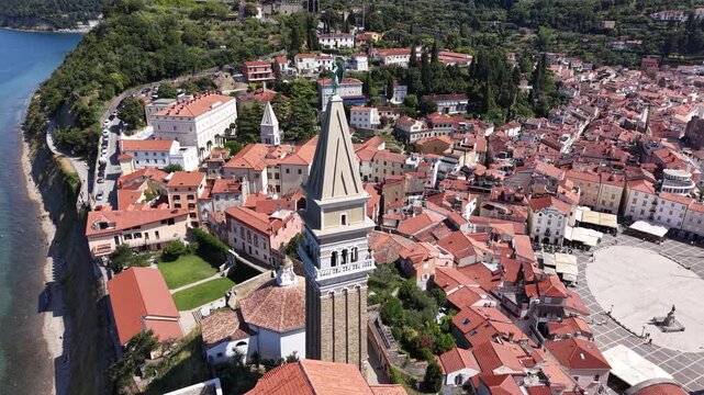 Drone shot of St George Parish Church bell tower in Piran, Slovenia
