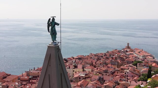 Aerial shot of St George bell tower and St Michael statue, Piran, Slovenia