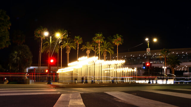 Los Angeles, California &ndash; August 2, 2026: Long exposure of Urban Light sculpture by Chris Burden at the Los Angeles County Museum of Art (LACMA) with vehicle light trails 