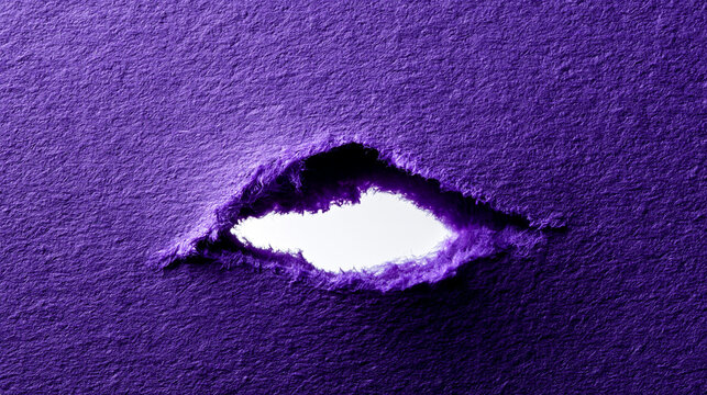 Close up of vibrant purple textured paper ripped to reveal a narrow white opening with copy space