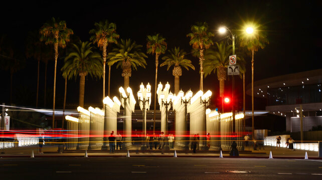 Los Angeles, California &ndash; August 2, 2026: Long exposure of Urban Light sculpture by Chris Burden at the Los Angeles County Museum of Art (LACMA) with vehicle light trails 