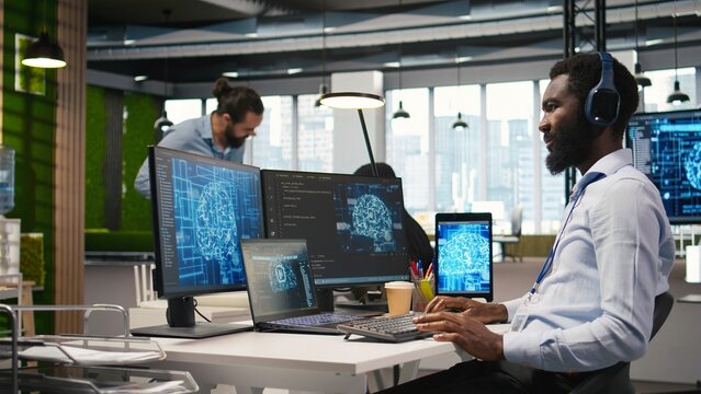 Programmer uses AI and machine learning across office devices to automate repetitive tasks and accelerate feature implementation with neural networks.