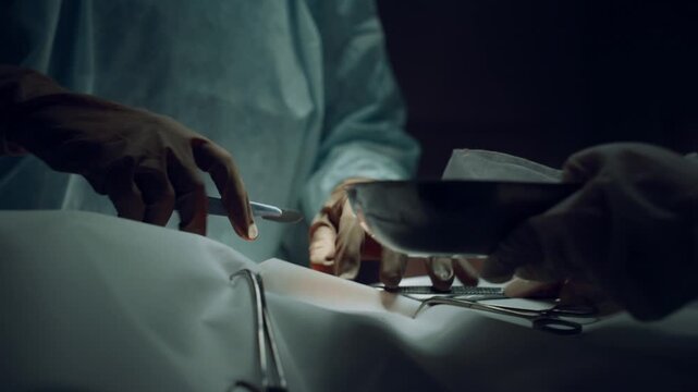 surgeon working in operating room with equipment