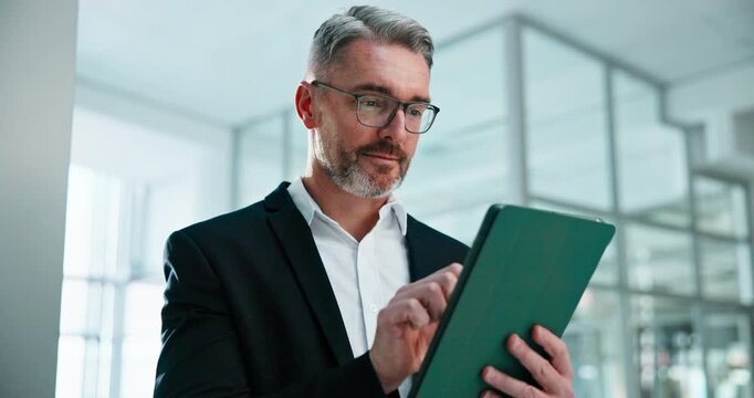 Finance, typing and business man on tablet for research, investment choice and planning in office. Corporate, mature and happy person on tech for financial report, proposal and stock market update
