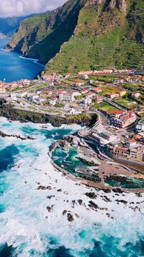 Porto Moniz coastal town with Atlantic Ocean surf impacting the rugged shoreline of Madeira Island