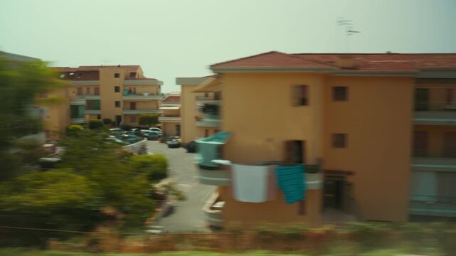 Houses in an Italian city seen during a leisure train trip