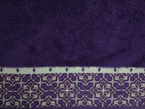 purple towel texture with decorative pattern border