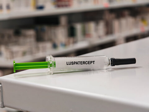LUSPATERCEPT erythroid maturation medicine for selected chronic anemias in a prefilled syringe on pharmacy shelf with blurred background